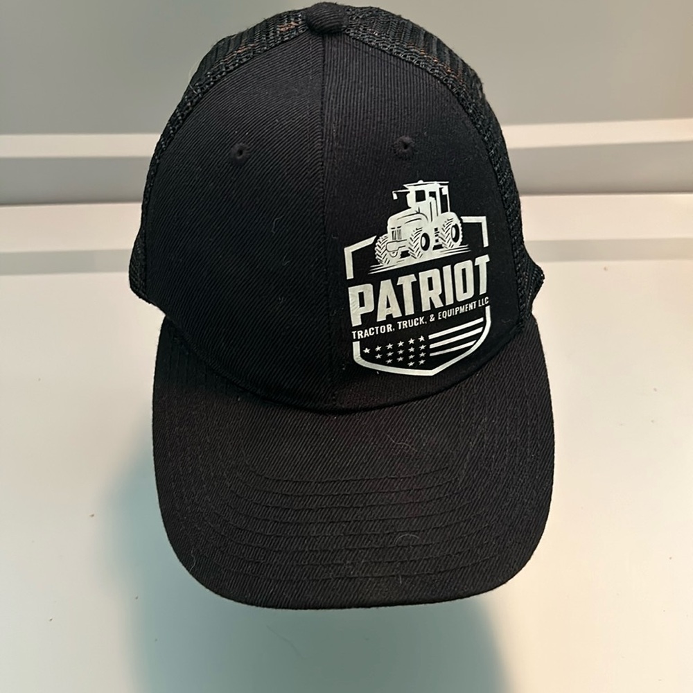 Vintage style PATRIOT Tractor Truck and Equipment LLC SnapBack hat.
